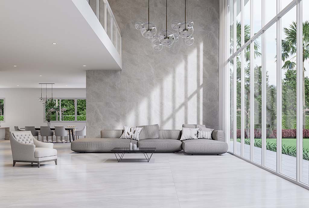 A beautiful white living room with tall windows.